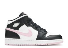 a pair of black and white sneakers with pink accents on the upper part of the shoe