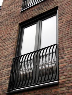 an apartment building with balcony and balconies