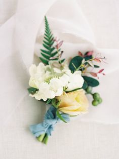 a bouquet of flowers on a white cloth