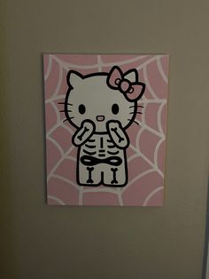 a hello kitty sticker on the side of a bathroom door