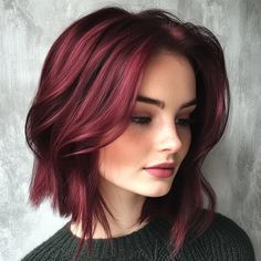 This striking cherry red lob (long bob) captures attention with its vibrant hue and textured layers. The hairstyle is characterized by its soft waves that add volume and movement, framing the face beautifully. Ideal for individuals looking to make a statement, this color and cut work well with a variety of skin tones, particularly those with fair to medium complexions, enhancing their overall glow. Maroon Hair, Soft Waves, Long Bob, Cut Work, Cherry Red, Skin Tones, Hair Color, Skin, Hair Styles