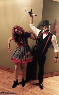 a man and woman dressed up in costumes