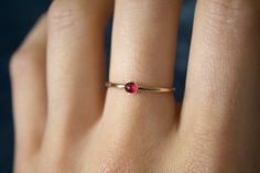 "STUNNING 14k gold filled or Sterling Silver handmade natural ruby ring ✨ * Listing covers the single ruby ring (twisted band sold separately). Beautiful 3mm natural ruby gemstone✨⚒️ Many cultures have long considered ruby a king's gem. Ruby symbolizes power, wealth, and protection. Many cultures have long considered ruby a stone of kings. When worn as a talisman, ruby's mystical properties extended to personal protection.  The ancient Burmese prized the ruby as the stone of soldiers. They believed it bestowed invulnerability.  Through the ages, the ruby has represented nobility, purity, and passion. The ruby is known as a protective stone that can bring happiness and passion into the life of the wearer.  The ruby is also believed to protect the wearer from negative entities that leach pos Simple 14k Gold Filled Round Rings, Everyday 14k Yellow Gold Ruby Ring, Dainty Ruby Ring In Gold, Red Round Ring For Everyday, Minimalist Gold Ruby Ring, Tiny Round 14k Gold Birthstone Ring, Tiny 14k Gold Birthstone Ring, Everyday Red Round Ring, Dainty Stackable Ruby Jewelry