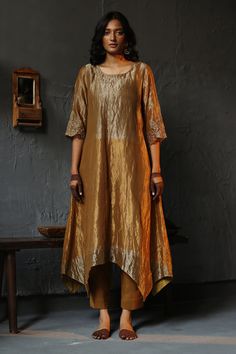 Shop for these amazing collections of Gold Kurta: Handloom Tissue Plain Round Asymmetric And Pant Set For Women by Shorshe Clothing online at Aza Fashions. Luxury Embroidered Tissue Silk Palazzo Set, Luxury Silk Straight Kurta Tunic, Luxury Silk Kurta With Mandarin Collar, Luxury Raw Silk Ceremonial Kurta, Luxury Raw Silk Pant Set For Eid, Luxury Handloom Raw Silk Kurta, Luxury Raw Silk Kurta For Festive Occasions, Luxury Asymmetrical Hem Kurta For Spring, Luxury Katan Silk Kurta For Designer Wear