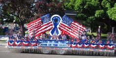 a parade float with an american flag theme