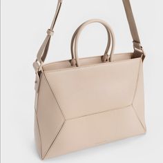 This Is A Brand New Purse With Double Handles, Zip Closure, An Adjustable And A Detachable Strap. -Singaporean Brand Charles Keith -Depth: 13cm -Width: 36cm -Height: 28.5cm -The Package Was Opened, But The Purse Was Never Used Modern Neutral Top Handle Shoulder Bag, Modern Rectangular Neutral Shoulder Bag, Modern Neutral Rectangular Shoulder Bag, Modern Neutral Shoulder Bag, Modern Rectangular Neutral Bag, Modern Neutral Rectangular Bag, Minimalist Beige Shoulder Bag With Top Carry Handle, Minimalist Beige Evening Bag, Modern Neutral Bag With Removable Pouch