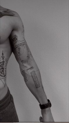 a man with many tattoos on his arm