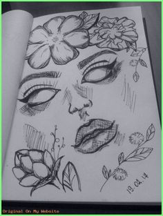 a drawing of a woman's face with flowers on her head