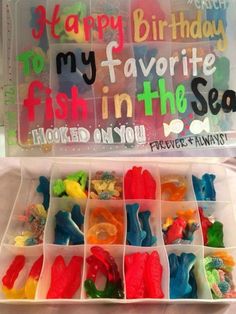 a plastic box filled with lots of gummy bears in it's trays