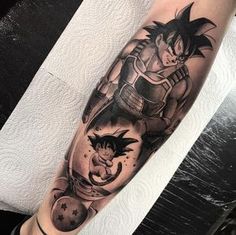 a man's leg with a dragon tattoo on it and an image of gohan