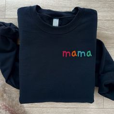 Mama Sweater Personalised Mum Jumper. Mama top, Mothers Day Gift, Mum sweater. Personalised gift.  This listing is for a high quality bespoke Mum sweatshirt that is a hand made item, made to order. Our Mama Sweatshirt is handmade with the finest machinery ensuring the ultimate quality for you. Using only premium  sweatshirts, your handmade Shirt will be SUPER soft and SUPER comfy Material: Luxuriously soft blend of 80% Cotton and 20% Polyester. Handmade Quality: Crafted with the finest machinery for unmatched quality. Customisation: Personalise with names! Add details in the 'personalisation section' at checkout. (Note: Exact spelling as provided will be used.) Design Options: Choose between printed or blank styles. How to Order ❤️ Select the colour and size of Sweatshirt you require ❤️ Se Mother's Day Slogan Sweatshirt With Long Sleeves, Mother's Day Gift Custom Print Sweatshirt, Mama Pullover, Mother's Day Sweatshirt With Custom Text, Mother's Day Custom Print Crew Neck Sweatshirt, Mama Sweater, Handmade Shirts, Mama Sweatshirt, Kid Names