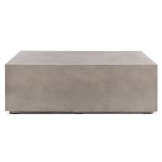 a concrete box sitting on top of a white surface