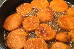 cooked carrots in oil cooking in a pan