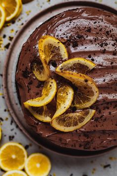 a chocolate cake with orange slices on top