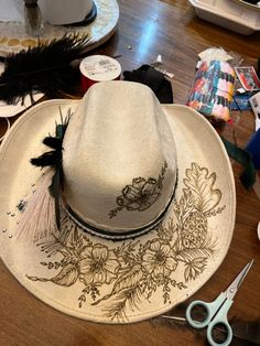 This is an EXAMPLE HAT AND NOT FOR SALE !! This amazing custom is done on a vegan wool cowboy hat. This was for a wedding and incorporated the wedding date ans name. This hat has already been sold but I can create a custom hat just for you. Just message me and we can discuss details, options and pricing. Wool hats start at 175.00 and Vegan wool/suede starts at 125.00.  Christmas orders close Dec 11th Western Hand Painted Hats For Country Events, Custom Flat Brim Hat For Western-themed Events, Country Style Hand Painted Brimmed Hat, Hand Painted Adjustable Western Hat, Hand Painted Brimmed Hat For Western-themed Events, Cowboy Hat Design, Custom Cowboy Hats, Rancher Hat, Diy Hat