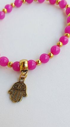 Stretchy bracelet hamsa Bracelet hand of fatima Jewelry | Etsy Bohemian Pink Charm Bracelet With Round Beads, Pink Bohemian Charm Bracelet With Round Beads, Pink Adjustable Hand-strung Charm Bracelet, Adjustable Pink Hand-strung Charm Bracelet, Spiritual Adjustable Pink Stretch Bracelet, Spiritual Pink Adjustable Stretch Bracelet, Hand-strung Pink Bracelets For Festival, Pink Hand-strung Bracelets For Festival, Pink Hand-strung Festival Bracelets