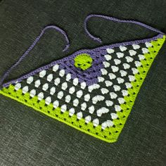 a crocheted purse sitting on top of a table