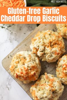 Biscuits on a wood tray Cheddar Drop Biscuits Easy, Bisquick Gluten Free Recipes, Gluten Free Busicuts Recipe, Gf Drop Biscuits, Gluten Free Cheese Buns, Gf Cheddar Biscuits, Gluten Free Biscuits Recipe, Gluten Free Garlic Bread Easy, Easy Gluten Free Biscuits Simple