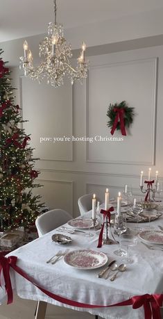 a dining room table set for christmas dinner