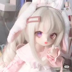 a doll with white hair and bunny ears