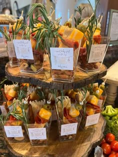 there are many different types of food on the trays in the display case at the store