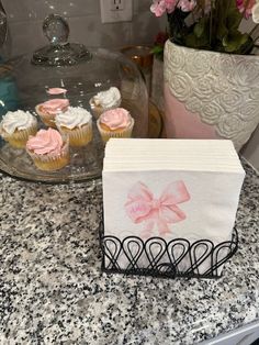 some cupcakes are sitting on top of a counter