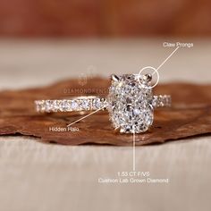 an image of a diamond engagement ring on a wooden surface with text describing its features