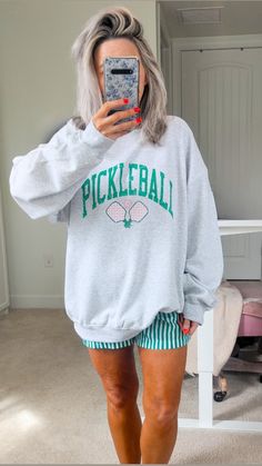 Ready to serve up some serious style? This distressed green and pink pickleball sweatshirt is the perfect gift for any pickleball lover or team. Made with a comfy 50/50 cotton-polyester blend, size up for an oversized fit and dominate the court with a preppy and trendy look.

SmileSoulThreads.com