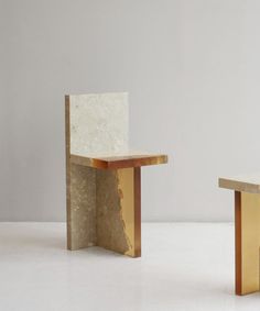 two pieces of furniture sitting on top of a white floor