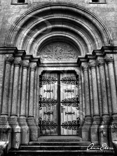 black and white photograph of an old church door