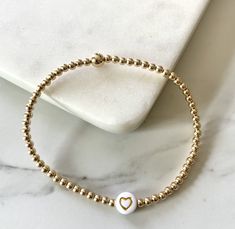 3mm Gold Filled Bead with Heart Letter Bead Colors Available: White & Gold or Black & white Gold Beaded Bracelet, Heart Letter, Gold Bead Bracelets, Letter Beads, Heart Bracelet, Gold Beads, Beaded Bracelet, Gold Filled, Beaded Bracelets