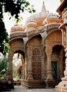 an intricately designed building with arches and pillars