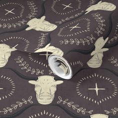 an animal themed wallpaper with cows and leaves on it's back drop cloth