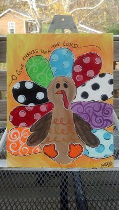 a painted turkey with hearts and words on it