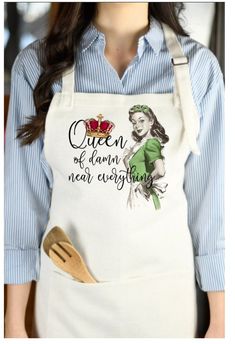 a woman wearing an apron with the words queen of hearts on it and a wooden spoon in her hand