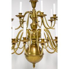 an antique brass chandelier with twelve candles