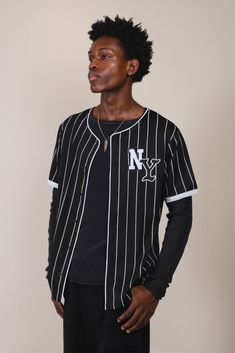 NY Pinstripe Baseball Jersey
#color_black Wide Legs Jeans, Curved Back, Jogger Shorts, Wide Legs, Baseball Jersey, Baseball Jerseys, Mens Outerwear, Black Media, Hoodie Top