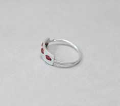 Ring handmade from sterling silver and threaded with red waxed cord. You can choose the colour of the cord. Although waxed cord is very durable even if washed, avoiding water will prolong the ring's life. You can thread another cord to replace it. I will send extra cord with each order in any case as part of the wrapping. :) This ring is made to order; please make sure you choose your size. Convo me if your size is not available. Feel free to ask me if you don't know which is the right size for Minimalist Adjustable Open Enamel Ring, Adjustable Open Ring In Red, Adjustable Open Red Ring, Modern Red Jewelry For Everyday, Modern Red Everyday Jewelry, Minimalist Sterling Silver Ruby Promise Ring, Modern Handmade Red Ring, Modern Handmade Red Rings, Red Minimalist Promise Ring