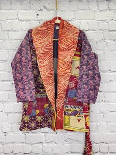 Our gorgeous coats are made from fine kantha embroidered cotton. This is a lightweight coat with an oversized collar, large pockets and a self-tie belt. Kantha coats are a “one size” style that measures approximately 37” in length, sleeve length 25”, shoulder to shoulder 19” and armpit to armpit, 28”. Recommended up to size 18. Care Instructions: Dry clean or hand wash and line dry for longest life. Disclaimer: The material used in this style is repurposed, vintage material. Small imperfections Multicolor Relaxed Fit Cotton Outerwear, Long Cotton Patchwork Outerwear, Winter Cotton Outerwear With Shawl Collar, Cotton Long Sleeve Robe For Winter, Patchwork Cotton Kimono For Fall, Fall Cotton Patchwork Kimono, Bohemian Winter Outerwear In Relaxed Fit, Bohemian Relaxed Fit Winter Outerwear, Long Sleeve Relaxed Fit Robe For Fall