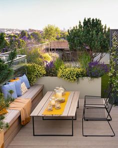 an outdoor seating area with table and chairs