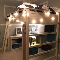 there is a loft bed with lights on it