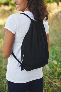 Organic and fairtrade cotton gym sack in black. perfect for any teams needing to carry items. This garment can be customised with either embroidery or print and comes in many more colours. Follow the link to see what other sustainable garments we can provide. #Sustainable #Workwear #brandedclothing Women's Workwear Fashion, Gym Sack, Elegant Scarves, Chic Tops, Black Bull, Denim Tote Bags, Denim Tote, Sweaters And Leggings, One Bag