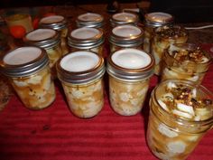 several jars filled with food sitting on top of a table