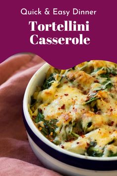 a casserole dish with cheese and spinach in it on a pink cloth