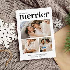 a magazine cover sitting on top of a sweater next to a christmas tree and snowflakes