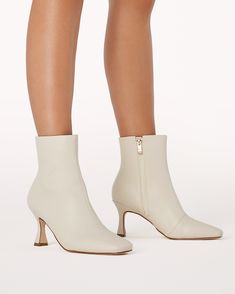 The Chyana Bootie Chalk is a stylish and versatile shoe that can be dressed up or down. It has a pointed toe that is both elegant and edgy, and a kitten heel that is comfortable and easy to walk in. The bootie is made from high-quality suede that is soft and luxurious, and it has a side zip closure that makes it easy to get on and off. The bootie also features a small, gold buckle detail at the ankle that adds a touch of feminine flair. The Chyana black suede bootie is perfect for any occasion, Steve Madden Sneakers, Baby Boy Shoes, Sweaters And Leggings, Comfortable Sandals, Fall Shopping, Kitten Heel, Suede Booties, Stiletto Heel