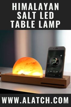 the himalayan salt lamp is sitting on top of a table