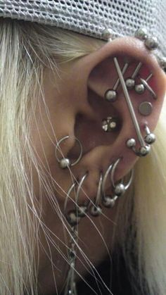 a woman with piercings on her ear