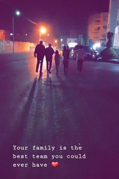 three people walking down the street at night with a quote on it that says, your family is this best team you could ever have