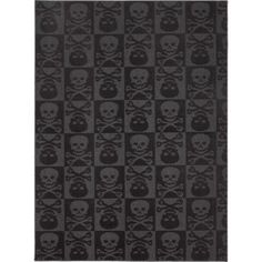 a black notebook with skulls and crossbones on the cover, in front of a white background